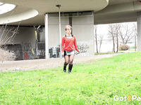 Short haired European amateur chick pees under the highway bridge