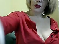 Naughty blonde in red clothes teases and exposes her tits and panties