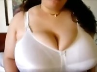 Curly chubby amateur Latina webcam nympho plays with her huge melons