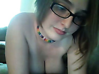 Yummy boobies of one webcam nerdy chick in glasses