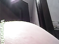Chunky white woman flashes her big booty in the public restroom