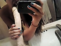 Cute Asian taped herself playing with dildo in the bathroom