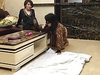 Asian mature woman in stockings humiliates crossdresser lying on the floor