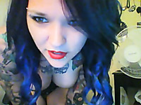 Tattoed teen gal in leather corset posing for me on webcam