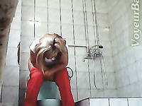 Blonde adorable lady in red panties filmed on hidden cam in the toilet
