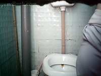 Pregnant amateur white chick pissing in the public toilet