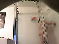 Hidden cam of big bottomed amateur brunette lady taking a shower