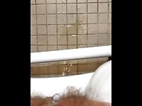 Petite teen pees in bathroom gets feet wet