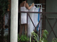My buddy spied on his mature brunette neighbor wandering in her balcony