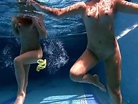Amateur girls get undressed completely for underwater fun in the pool
