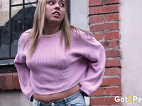 Stunning amateur white blonde babe pulls down her jeans and pisses on the sidewalk
