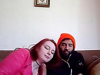 An amazing redhead sucking and rides her boyfriend on the couch