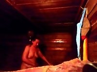 Mother washes tits in a hot bathhouse while her son is spying on her