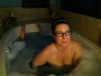 Kinky nerdy bosomy MILFie babe takes a foamy bath for me on webcam