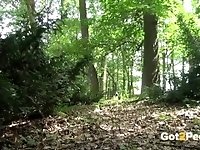 Blonde gushes piss while in the woods