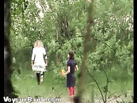 Cute young blonde girl walks in the high grass to piss