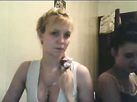 Two naughty blonde and brunette girls were posing in their white tank tops