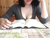 Reading books is so arousing that a brunette orgasms during it