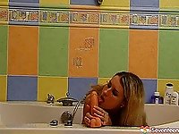 Washing her pussy makes the skinny blonde teen horny